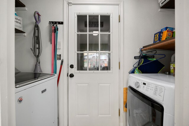 laundry room featuring washing machine and clothes dryer