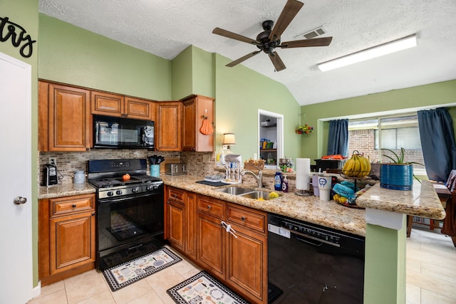 kitchen with kitchen peninsula, black appliances, ceiling fan, and sink