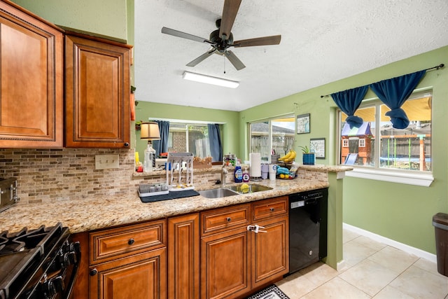 kitchen with black appliances, ceiling fan, and a textured ceiling