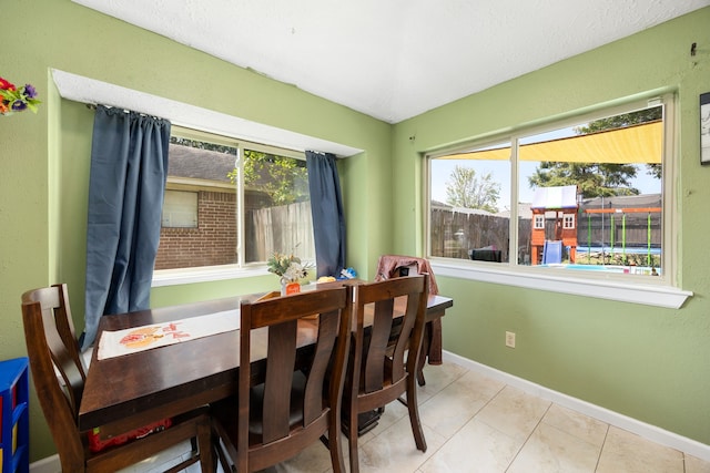 dining room featuring light tile patterned floors