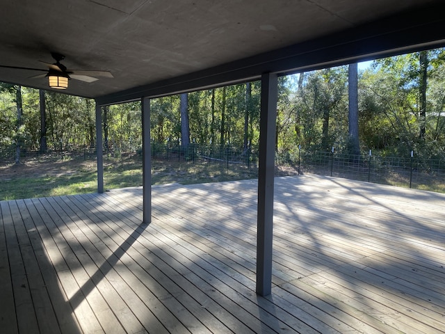 wooden terrace featuring ceiling fan