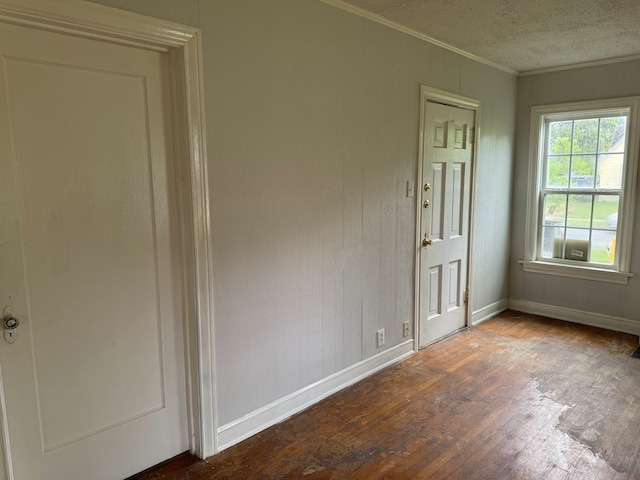 unfurnished room with wood-type flooring and ornamental molding