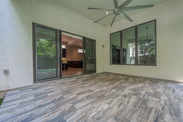 spare room featuring wood-type flooring and ceiling fan