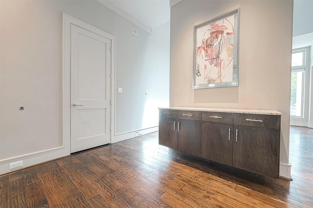 hallway featuring dark wood-type flooring