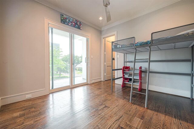 bedroom with wood-type flooring, access to exterior, and ornamental molding