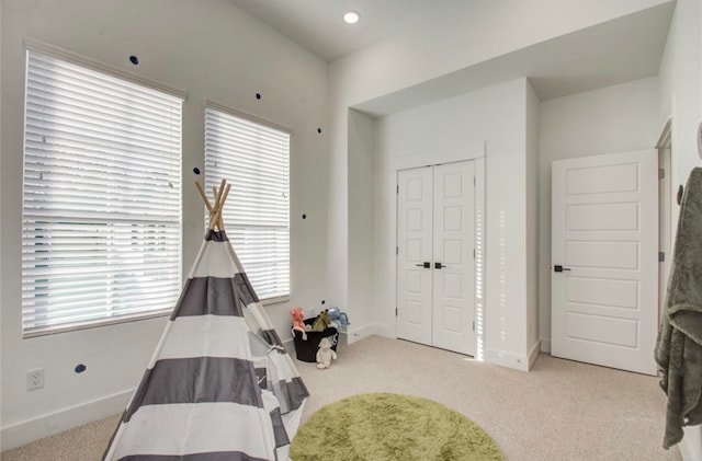 carpeted bedroom featuring a closet