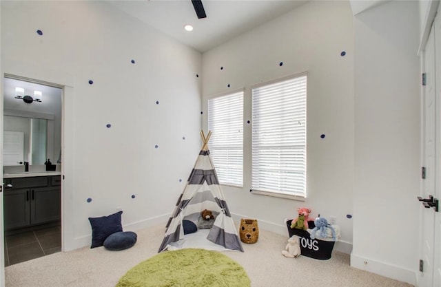 recreation room with light carpet