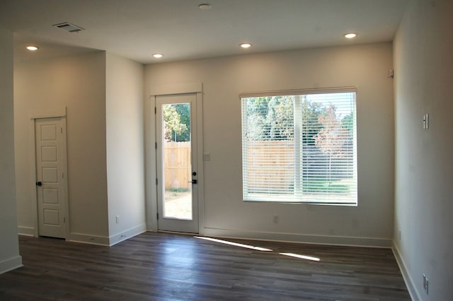 entryway with dark hardwood / wood-style floors and a wealth of natural light