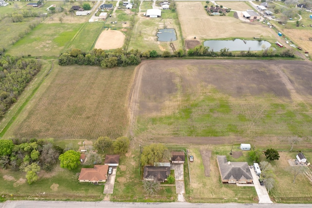 aerial view with a water view and a rural view