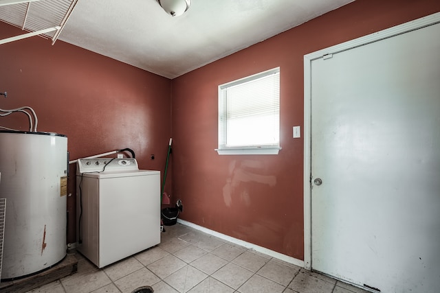 washroom featuring washer / clothes dryer, light tile patterned floors, and gas water heater