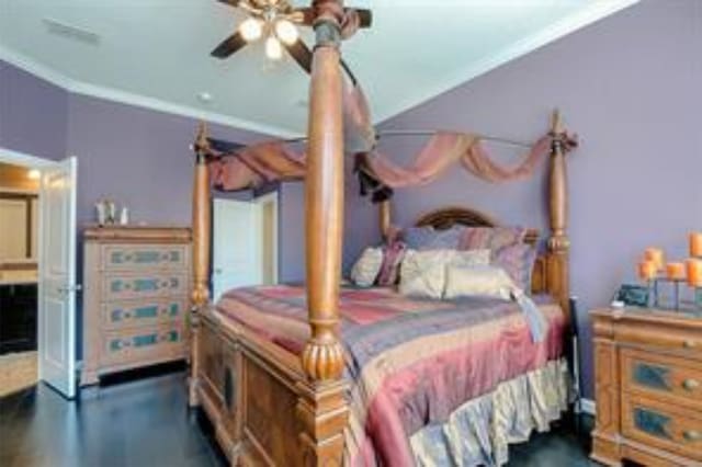 bedroom featuring ceiling fan and ornamental molding