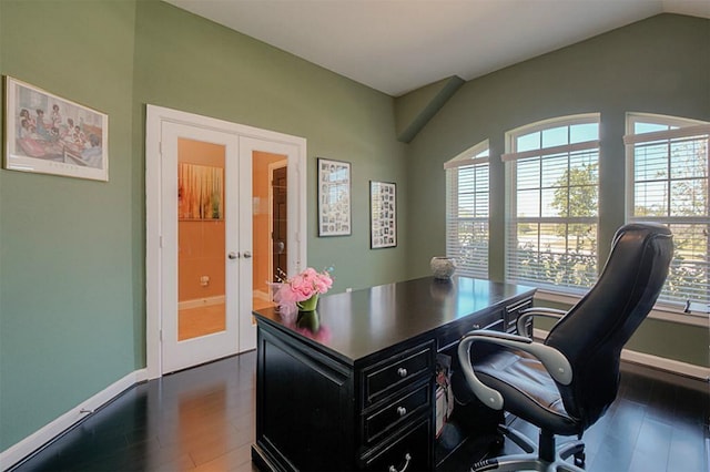 office featuring vaulted ceiling, dark wood-type flooring, french doors, and plenty of natural light