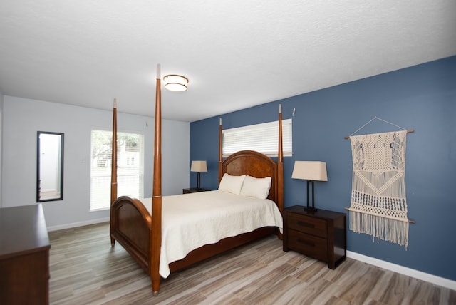 bedroom featuring wood-type flooring