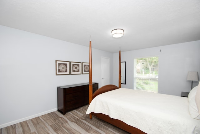 bedroom with light wood-type flooring