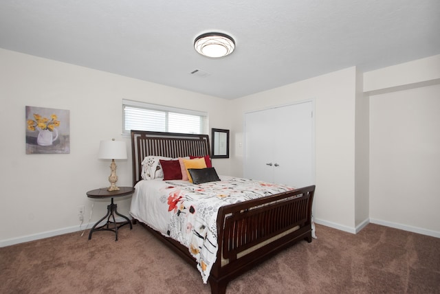 bedroom featuring dark colored carpet