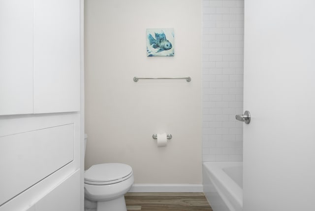 bathroom featuring hardwood / wood-style floors and toilet