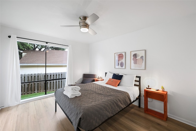 bedroom with ceiling fan and hardwood / wood-style flooring