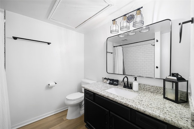 bathroom featuring vanity, a shower with curtain, hardwood / wood-style floors, and toilet