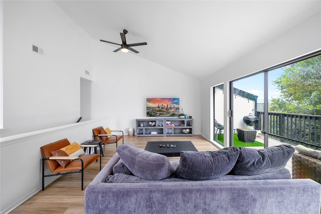 living room with ceiling fan, light hardwood / wood-style floors, and high vaulted ceiling