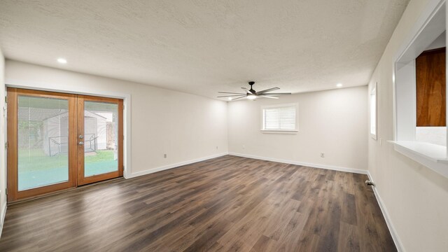 spare room with ceiling fan, dark hardwood / wood-style floors, and a textured ceiling