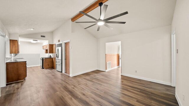 unfurnished living room with high vaulted ceiling, wood-type flooring, ceiling fan, and sink