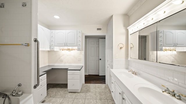 bathroom featuring tile patterned flooring and vanity