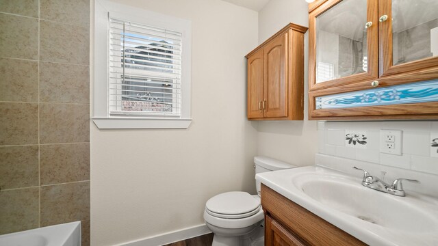 bathroom featuring wood-type flooring, vanity, and toilet