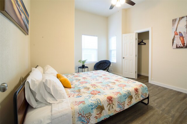 bedroom featuring ceiling fan and dark hardwood / wood-style flooring