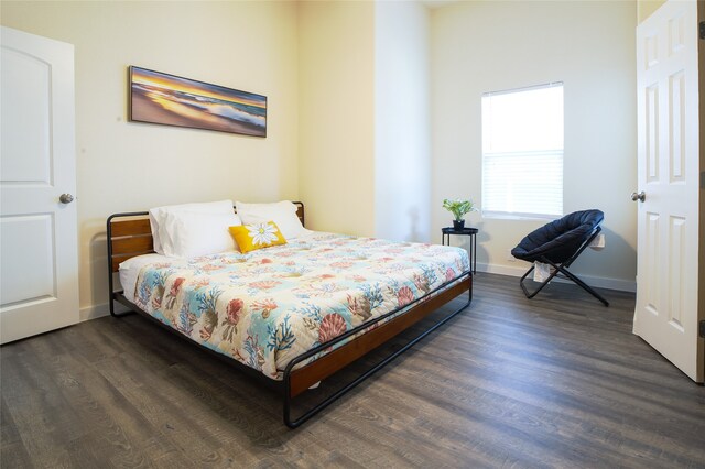 bedroom featuring dark hardwood / wood-style flooring