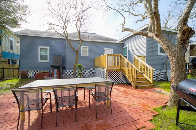 rear view of property featuring a patio area