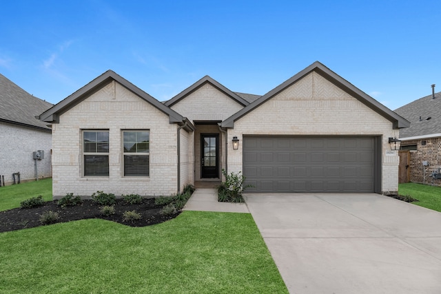 view of front of house with a garage and a front yard