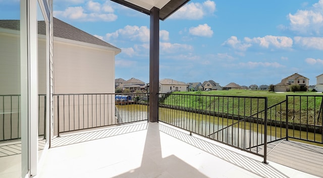 balcony featuring a water view