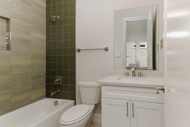 full bathroom with vanity, tiled shower / bath combo, and toilet