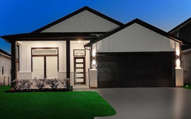 view of front facade with a front yard and a garage