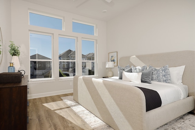 bedroom featuring ceiling fan and wood-type flooring