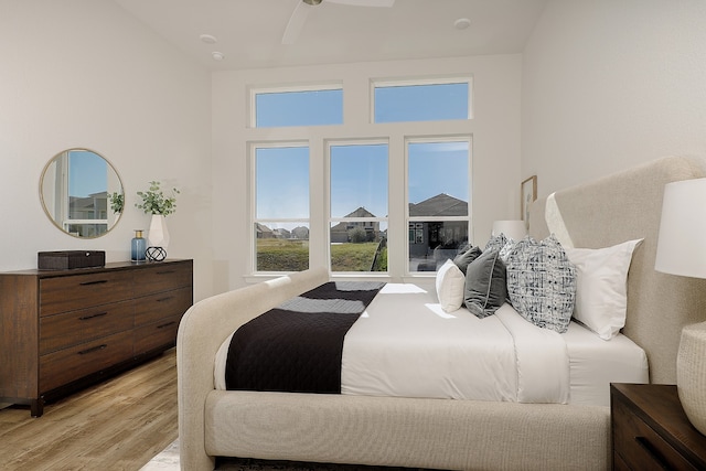 bedroom featuring light wood-type flooring and ceiling fan