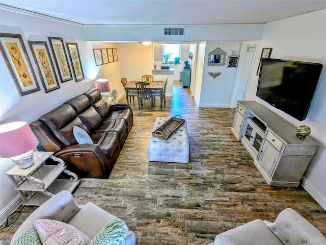 living room with ornamental molding