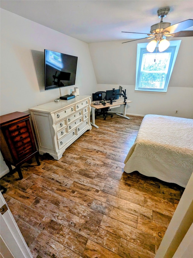 bedroom with ceiling fan and wood-type flooring