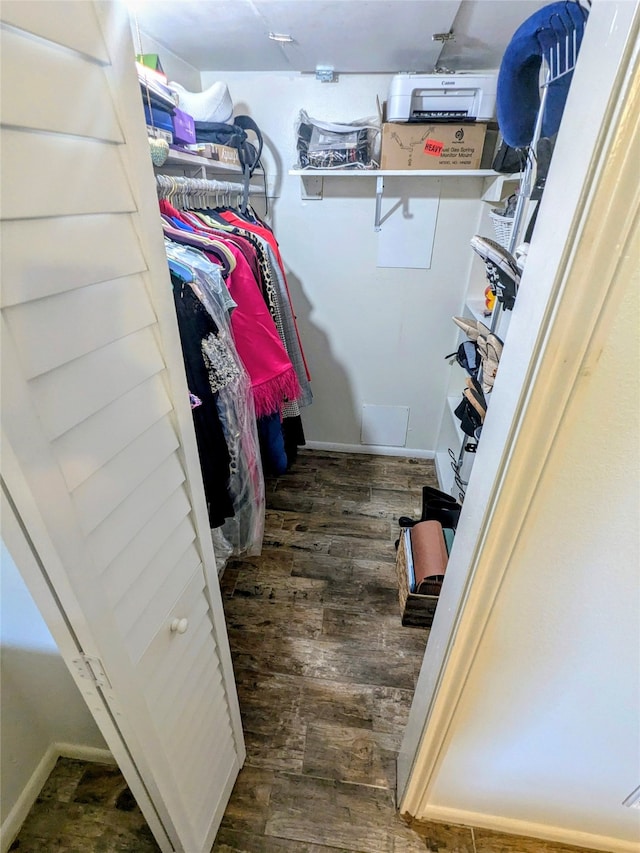 walk in closet featuring dark hardwood / wood-style floors