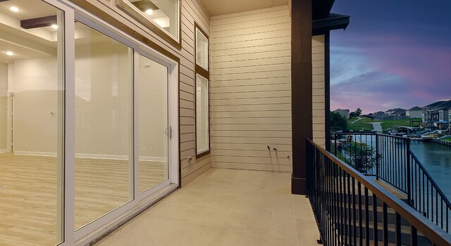 view of balcony at dusk