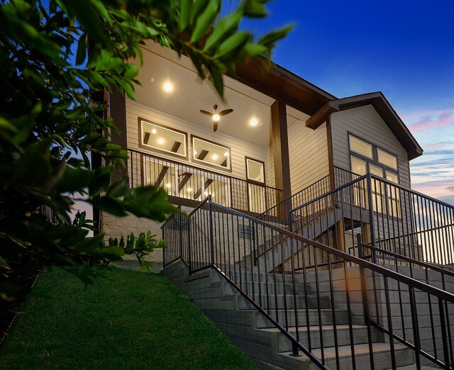 property exterior at dusk with covered porch