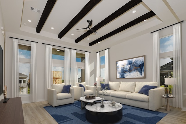 living room with ceiling fan, beamed ceiling, and light wood-type flooring