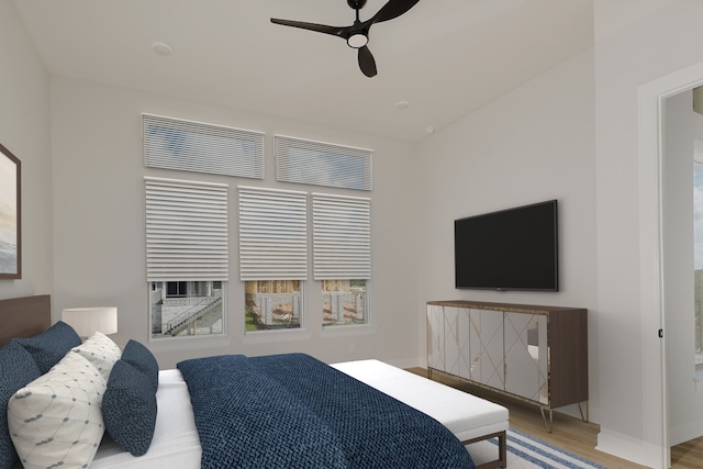 bedroom with hardwood / wood-style floors and ceiling fan