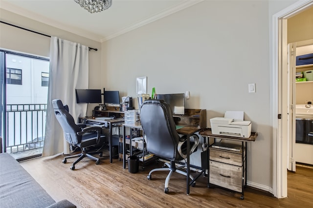 office area with ornamental molding and hardwood / wood-style floors