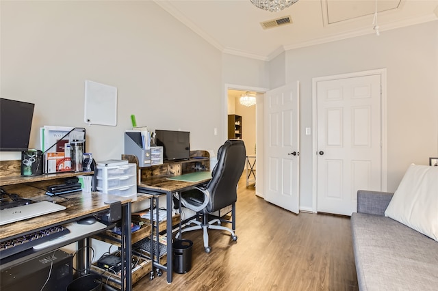 office featuring hardwood / wood-style flooring and crown molding