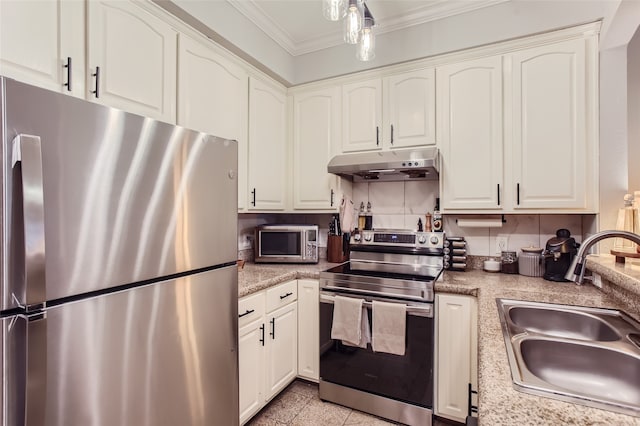 kitchen with ornamental molding, stainless steel appliances, white cabinetry, and sink