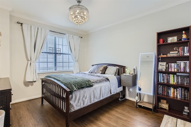 bedroom with ornamental molding, a chandelier, and dark wood-type flooring