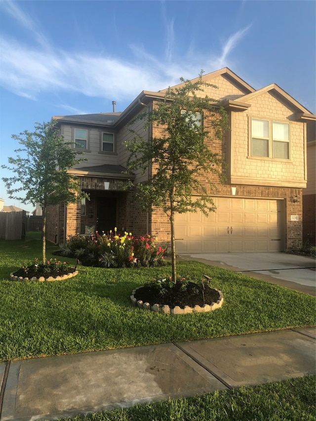 view of front of home featuring a front lawn and a garage