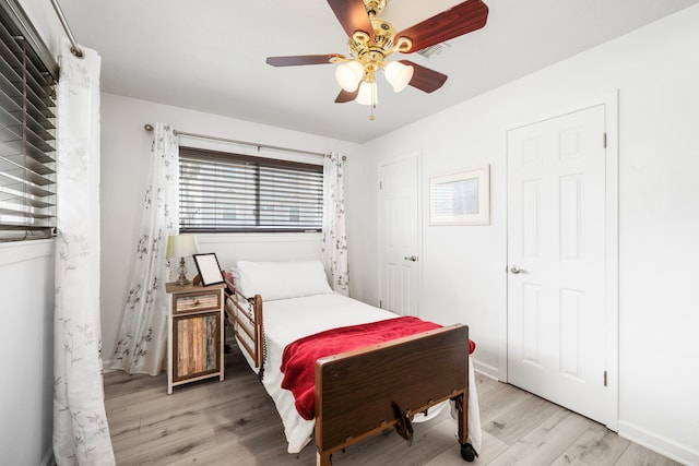 bedroom featuring ceiling fan and light hardwood / wood-style flooring