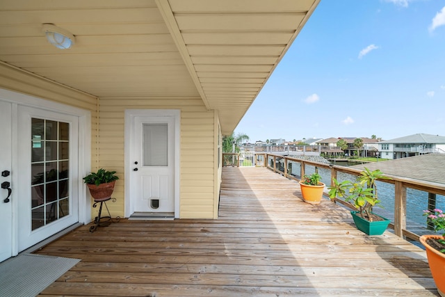 wooden deck with a water view